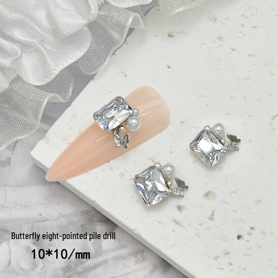 Elegant Nail Art: Pearl & Butterfly Inlaid Pigeon Egg with Zirconia and Rhinestones