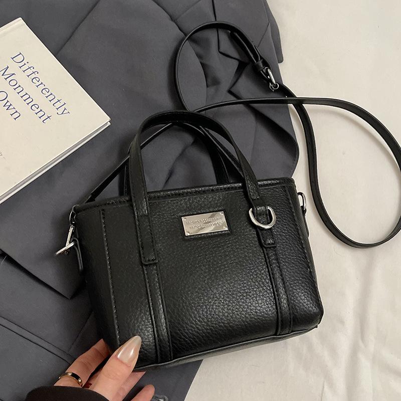 Spring hot sale lychee pattern high-end portable bucket bag Korean version casual small fresh temperament versatile messenger women's bag