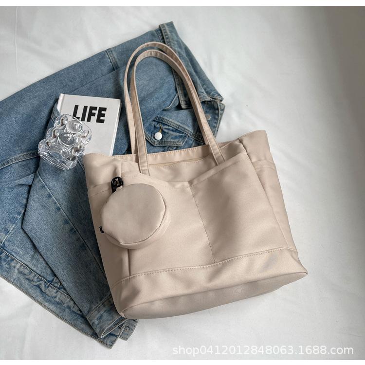 

Casual commuter canvas bag women s 2025 new large-capacity fashion shoulder bag simple texture commuter tote bag