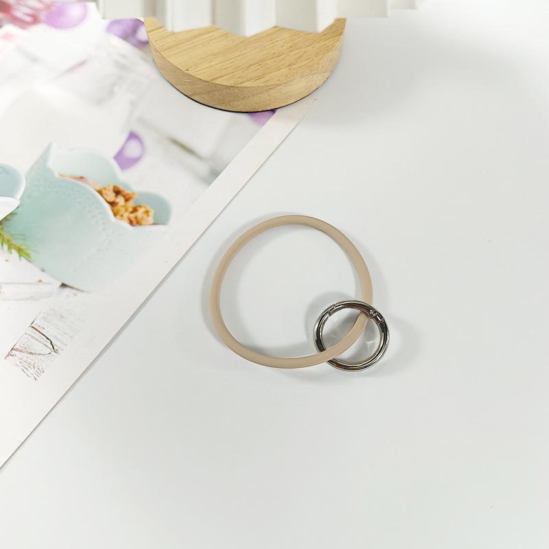 Einfarbige Silikon-Handyhülle mit befestigtem Schlüsselanhänger-Lanyard zum Schutz vor Verlust.