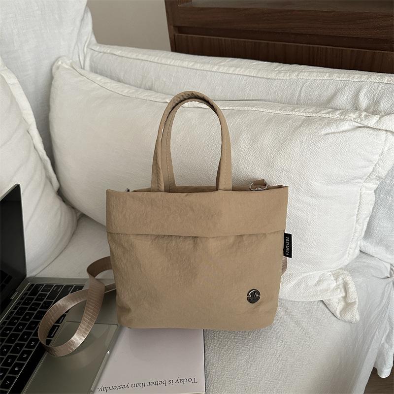 

Solid color bag women s messenger bag simple casual shoulder bag women 2025 new fashion versatile canvas hand bag women