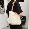 Koreanische Version tragbare Damen-Tasche für Pendler Winter Neu Ausländischer Stil Pendler-Achseltasche Studentenmode Canvas Make-up-Klasse Tragetasche