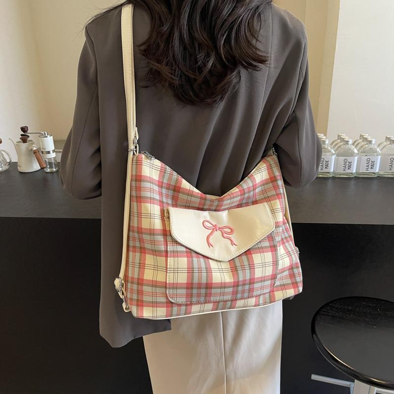 Version kontrastierende gestreifte Tragetasche für Damen Sommer neue Mode Akademie-Stil Schleife einzelne Schultertasche Premium