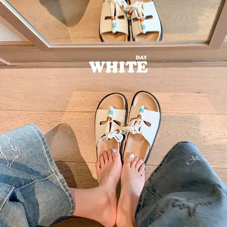 

Thick-bottomed cross-strap open-toed cool slippers for women to wear summer 2025 new versatile beach vacation one-word slippers 35