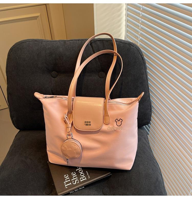 

Casual large-capacity nylon tote bag female dragon bags Xiang portable 70th anniversary women s bag simple shoulder bag рожевий