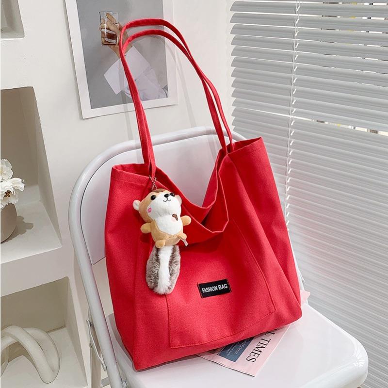

Candy color Korean version canvas bag women s casual versatile simple large-capacity tote bag shoulder style student bag рожевий