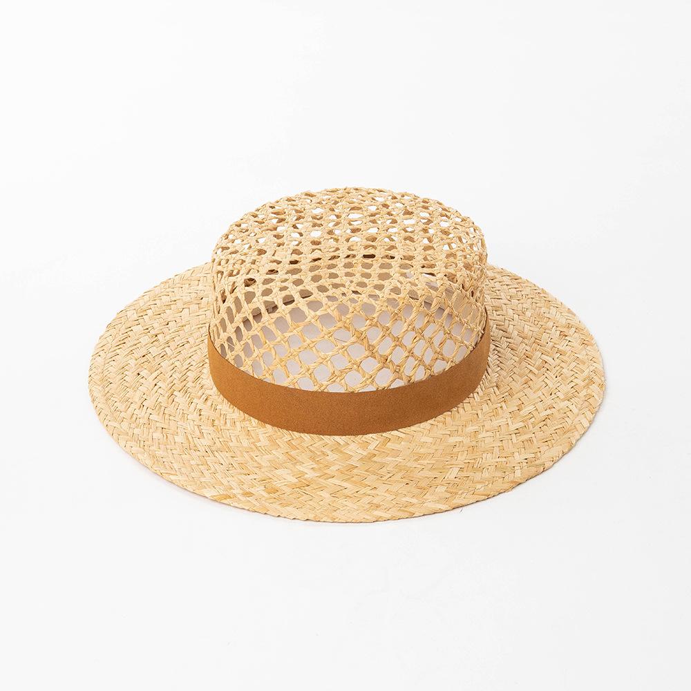 European and American spring and summer new fashion casual hand-woven hollow fleece webbing raffia flat top hat outdoor sunshade straw hat