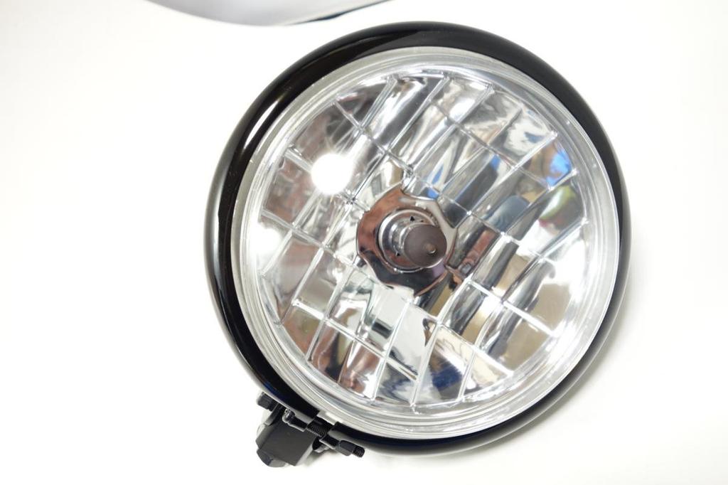 5.5-inch Bates-style headlight, black body, H4 bulb, custom headlight with clear lens.