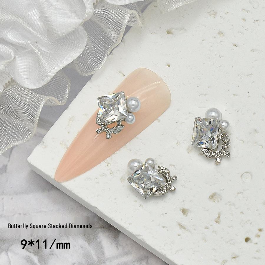 Elegant Nail Art: Pearl & Butterfly Inlaid Pigeon Egg with Zirconia and Rhinestones