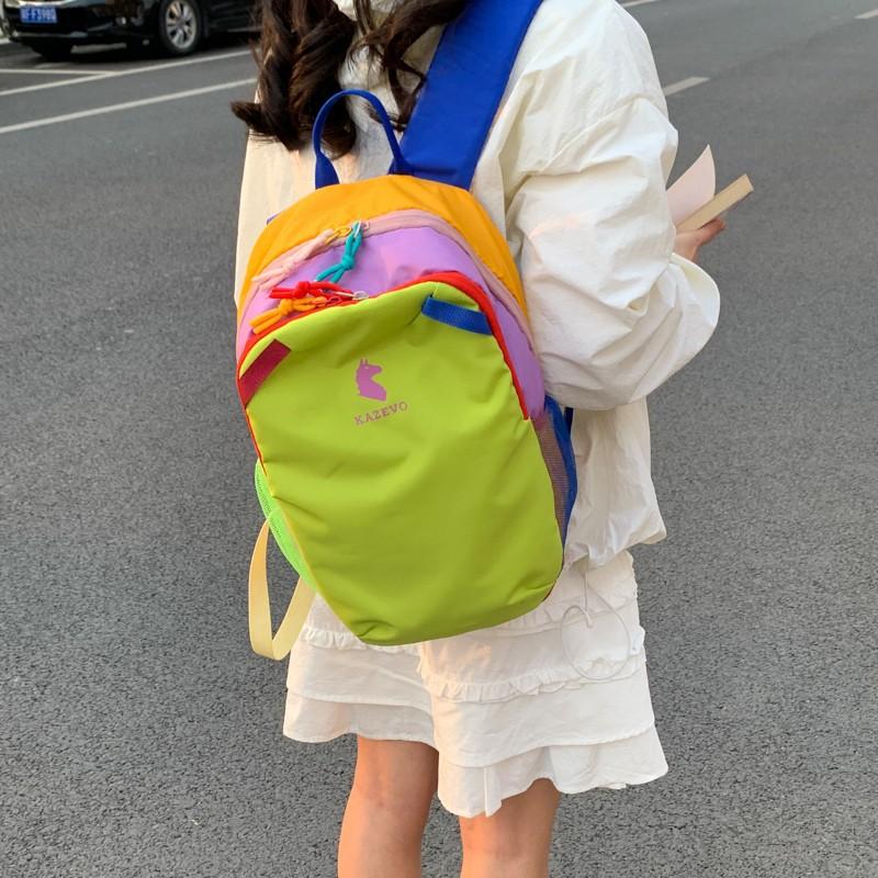 Zaino nuovo portatile colore a contrasto dopamina stile antivento anti-schizzi zaino da viaggio studente classe zaino da esterno per uomo e donna