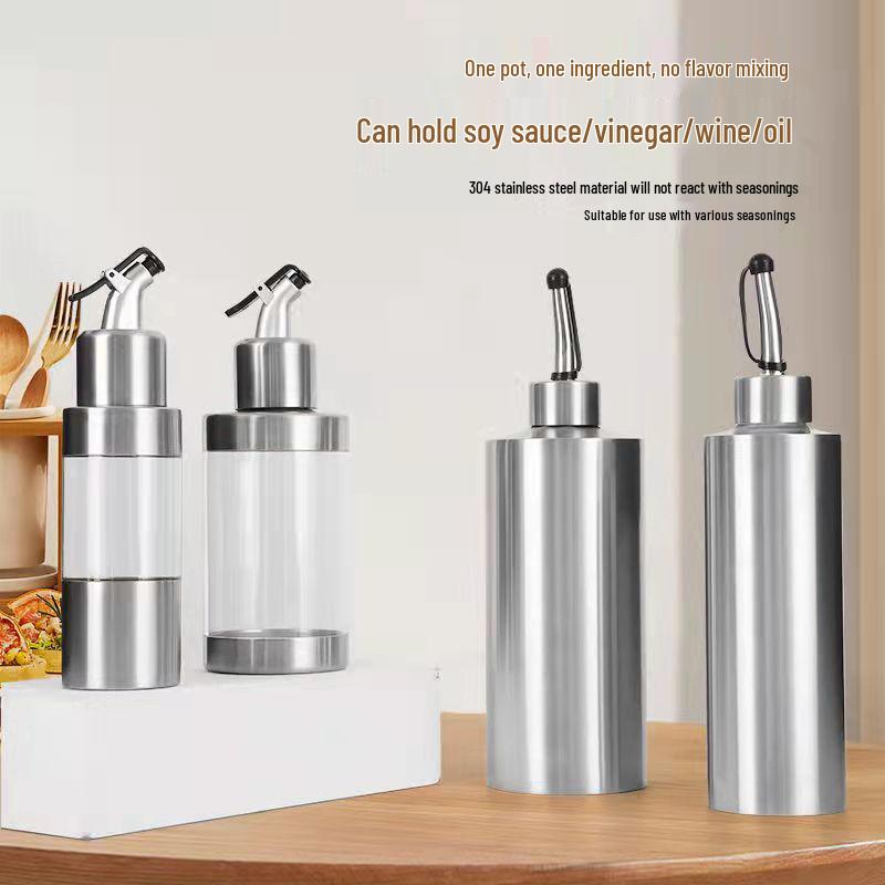 Cylindrical Stainless Steel Seasoning Bottles: Transparent Oil, Soy Sauce, and Vinegar Containers for the Kitchen.