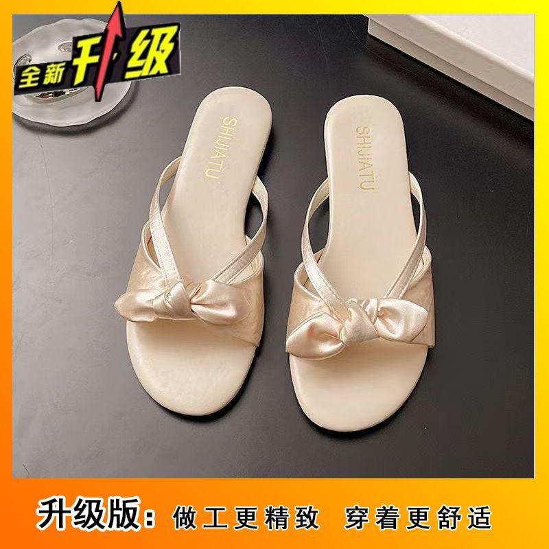 Bow-tied small cool slippers women's summer wear 2025 new flat-bottomed fairy style French versatile holiday sandals