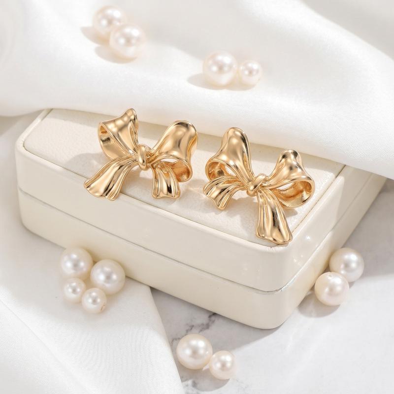 Hot-selling French gold bow stud earrings women's small fresh tied sweet earrings personalized ear jewelry stud earrings