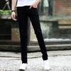 Pantalones vaqueros de tiro medio con cremallera y múltiples bolsillos para hombre, pantalones vaqueros rectos ajustados para primavera y otoño, ropa de calle