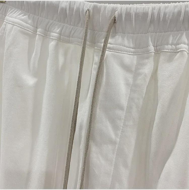 SUBHUMAN Pánská tmavá série: Slonově bílé zkrácené harémové pletené kalhoty - Letní ležérní móda