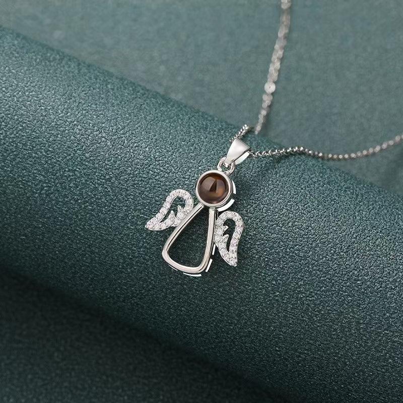 

Кулон в виде ангельских крыльев на заказ и елочная игрушка с проекцией фото