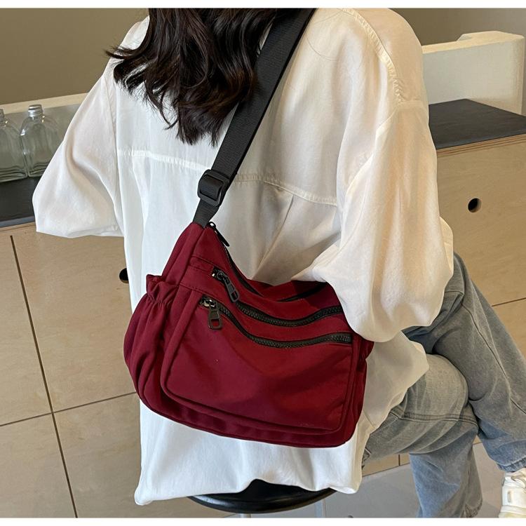 

2025 новая повседневная простая холщовая женская сумка однотонная весенняя универсальная сумка через плечо большой вместимости модная сумка-мессенджер сумка бордовый