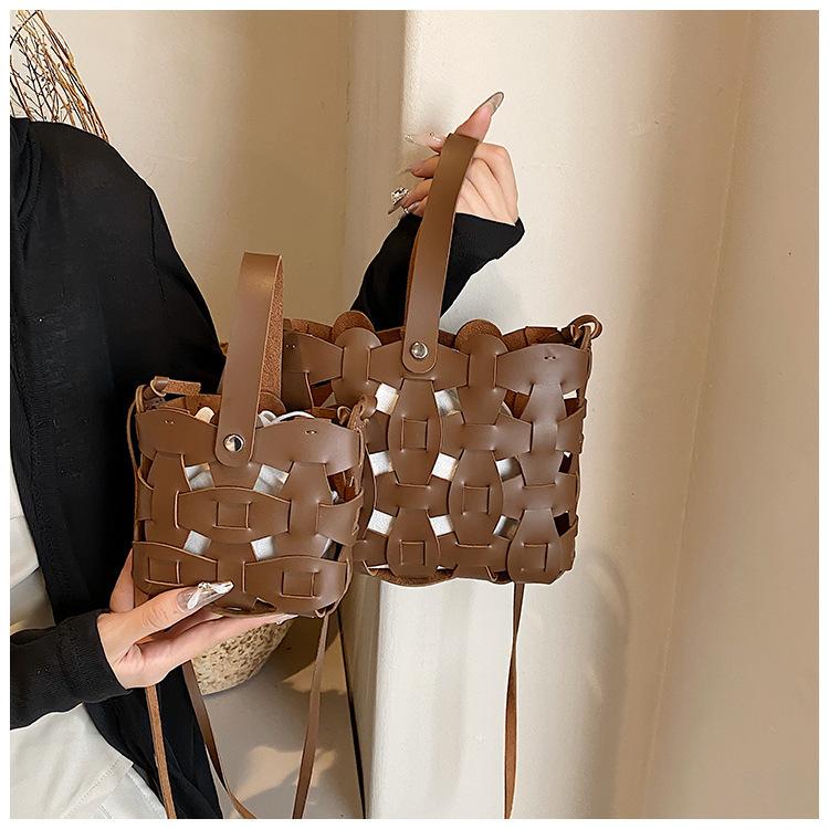 

New hollow handbag women s retro bucket hand-woven bag European and American single shoulder oblique span pu small bag Small