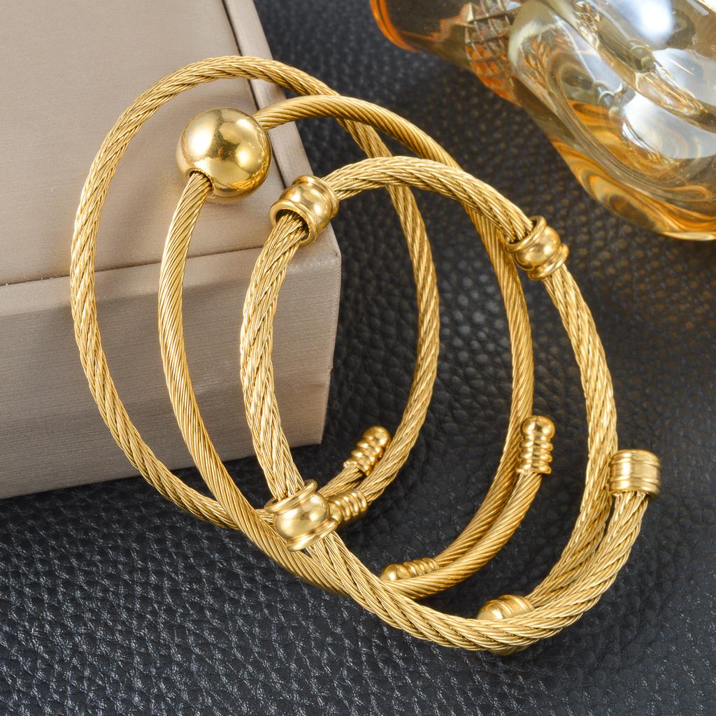 Trend European and American Personality Twist Opening Adjustable Twist Steel Wire Gold Ball Bracelet 2026
