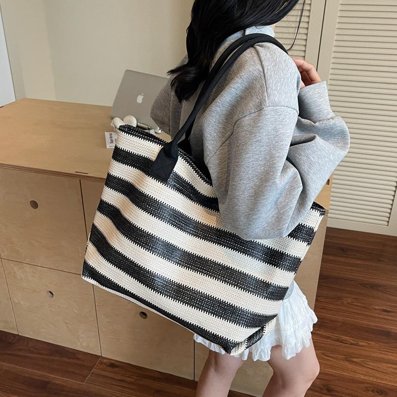 Large capacity fashion straw bag women's stripe contrasting color resort beach bag temperament commuter portable shoulder bag