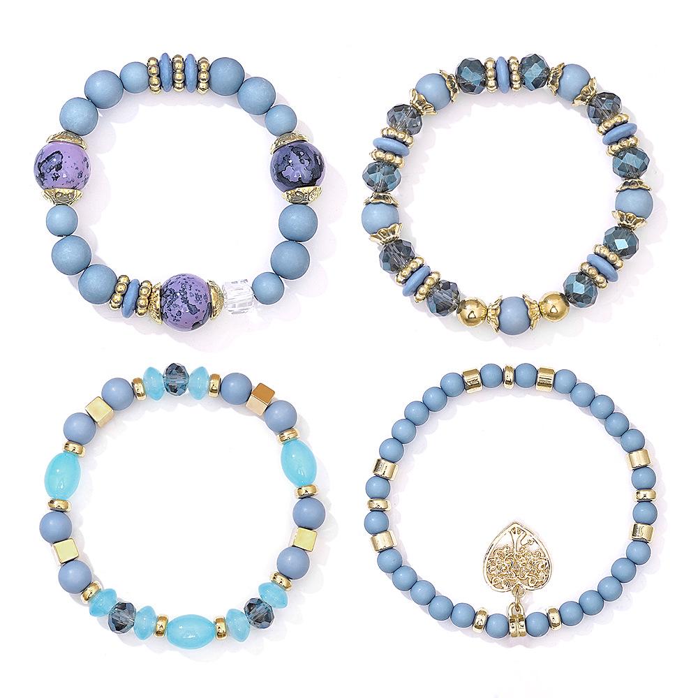 Bohemian Ethnic 4-Piece Bracelet Set: Multi-Layer Stackable with Peach Heart Tree Pendant & Acrylic Beads.