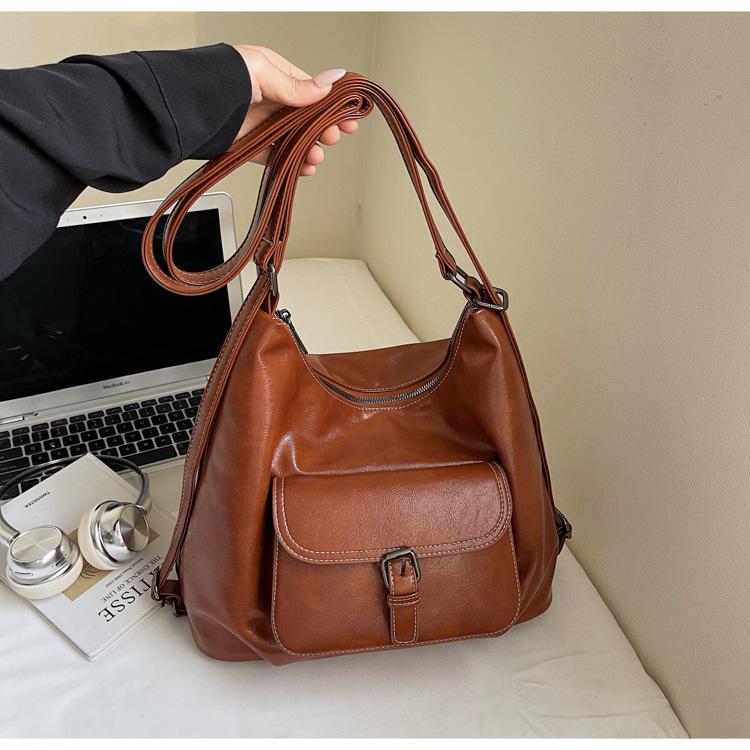 

2025 new Korean simple large-capacity tote bag women s fashion personalized belt buckle locomotive wind backpack коричневый