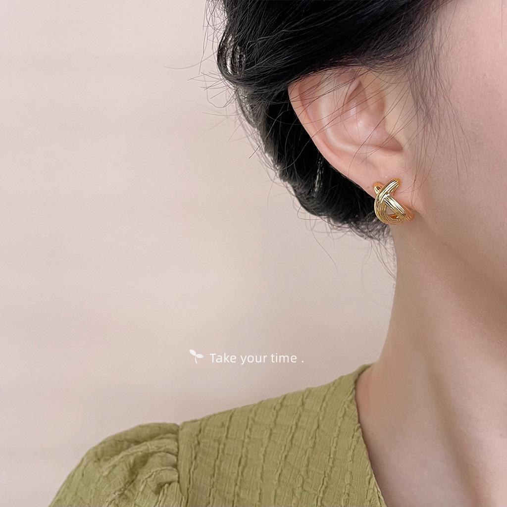 Fashion texture sense European and American style cross earrings design sense personality versatile curved fishtail high sense earrings