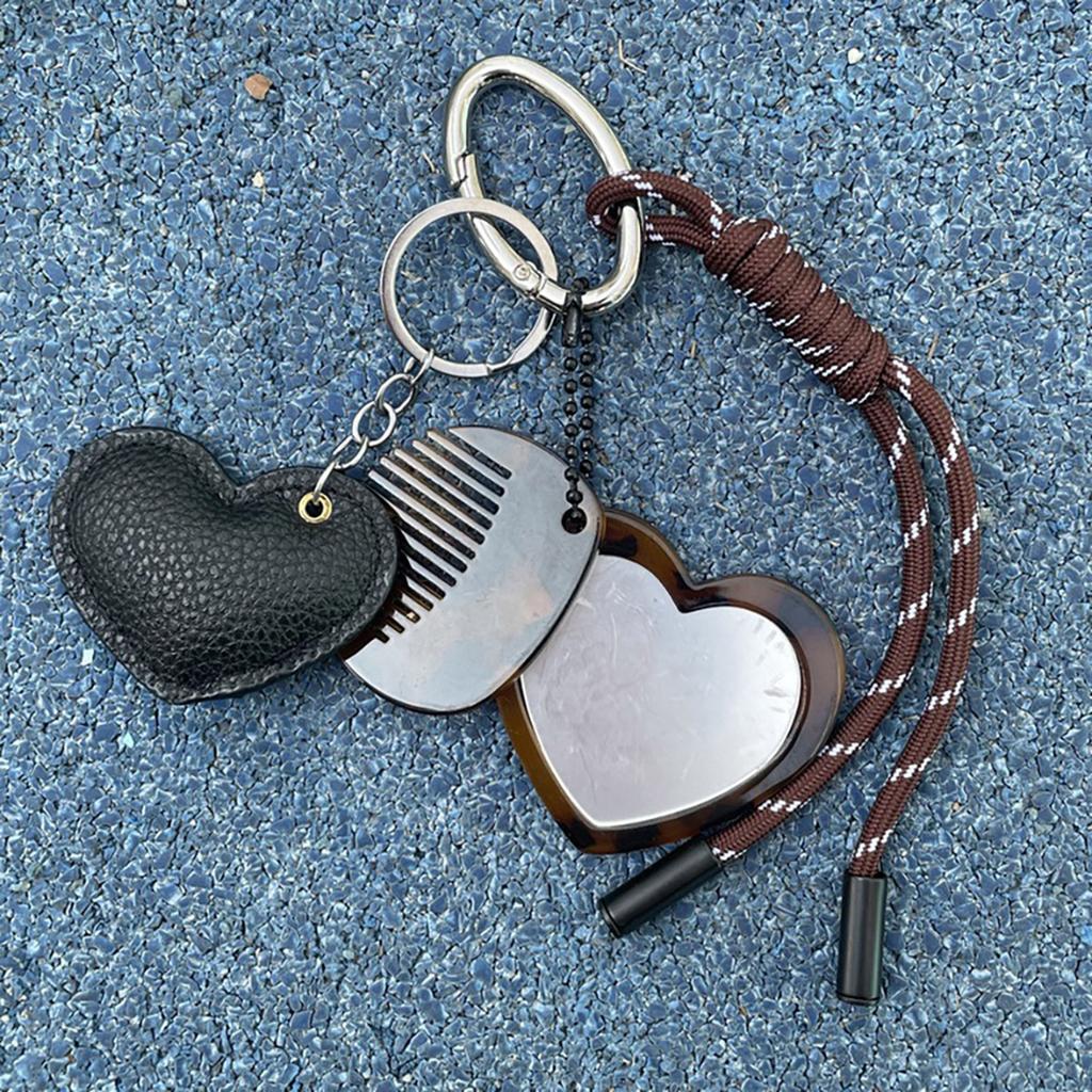 Kreative Designs Multifunktionaler Schlüsselanhänger Kamm Spiegel Tragbares Haarwerkzeug und Kosmetikzubehör für den täglichen Gebrauch