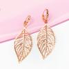 Purple Gold Color Gold Hollow Leaf Earrings Women'S Foreign Gas Plated Rose Gold Ear Buckles