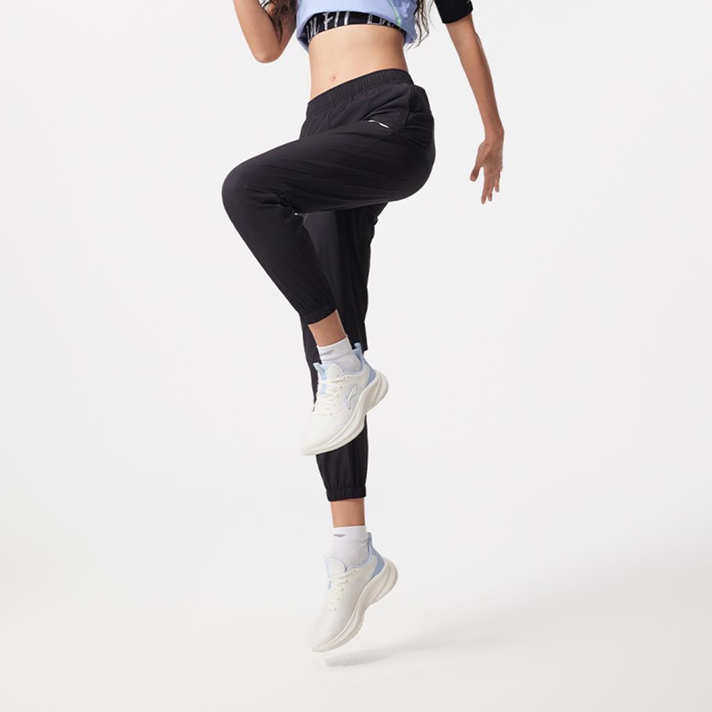 Li-Ning Jednoduché ležérní zúžené jednobarevné pletené sportovní kalhoty dámské spodky černé AYKV130-1