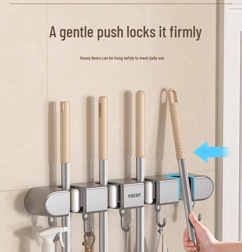 Wieszak ścienny na miotłę i mop: Rozwiązanie do zawieszania bez wiercenia na drzwiach łazienkowych lub toaletowych.