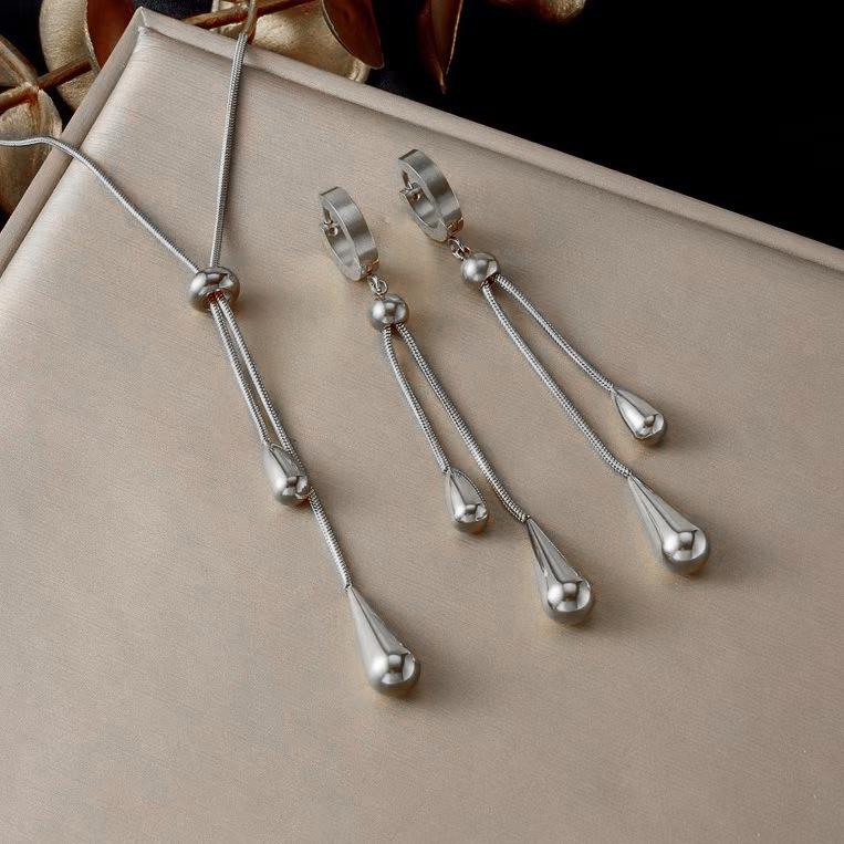 

Минималистичный титановый кулон-капля и набор серег