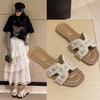 Xiaoxiangfeng soft-soled slippers female outer 2025 autumn new flat bottom one word summer pearl beach fairy fashion foreign style