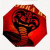 Cobra Kai Fashionable Automatic Opening/Closing Folding Umbrella. Portable and Foldable, Ideal for Gift, Travel, and Daily Use.