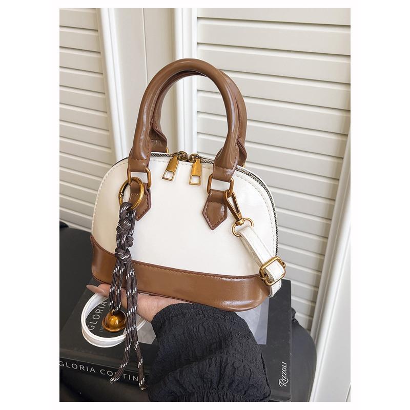 Die Handtasche ist modisch und retro, die Umhängetasche ist stilvoll und die Crossbody-Muscheltasche ist stilvoll