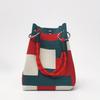This multi-color knitted retro bucket handbag is simple and color-blocked, versatile and easy to carry with you