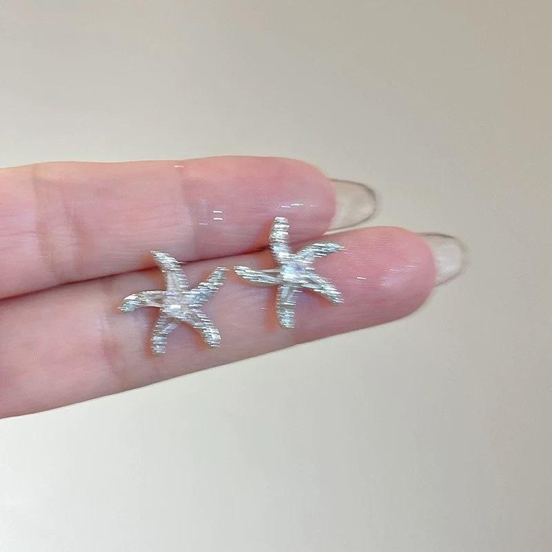 

Dancing starfish zircon silver needle earrings women s light luxury fashion high-end earrings new personalized versatile earrings