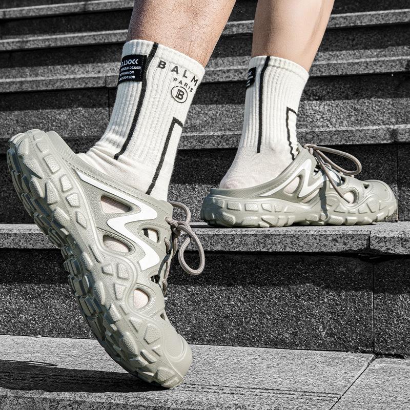 Moda Lato 2025 Nowy Styl Męskie Buty Jaskiniowe Puste Oddychające Kapcie Plażowe Outdoorowe Wygodne Lekkie Modne Casualowe Sandały