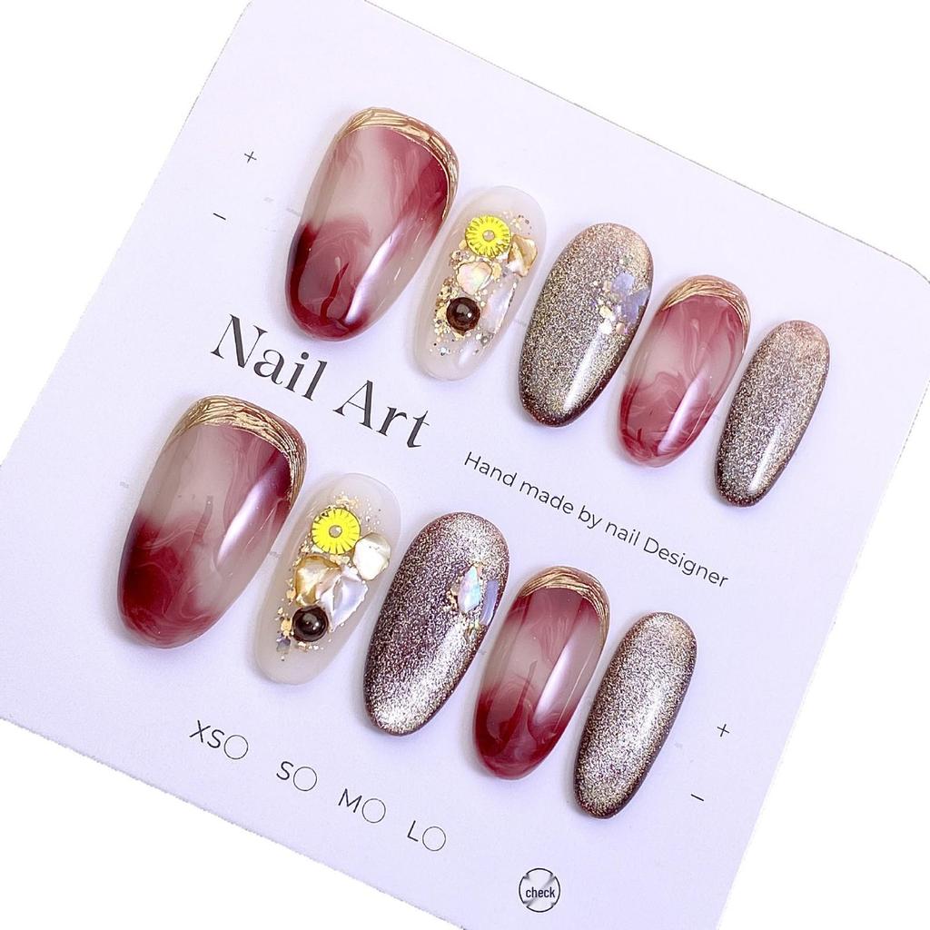 New Year Cat Eye Nails: Wine Red Gradient with Gold Foil, 3D Rhinestones, and Magic Mirror Powder