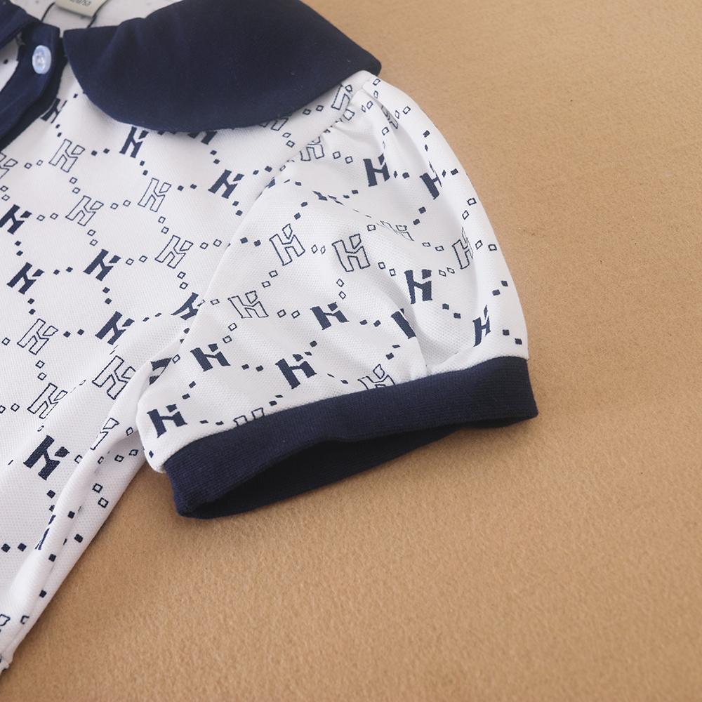 Flickornas tryckta pikétröja klänning med marinblå krage Kortärmad A-linjeformad klänning med monogrammönster Barnvita sommarklänningar