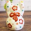 Cute Kutani Ware Maneki-neko Figurine with Raised Hands, Floral Design, and Rug. Perfect for Feng Shui, Good Luck, and Home Decor. A Perfect Gift for