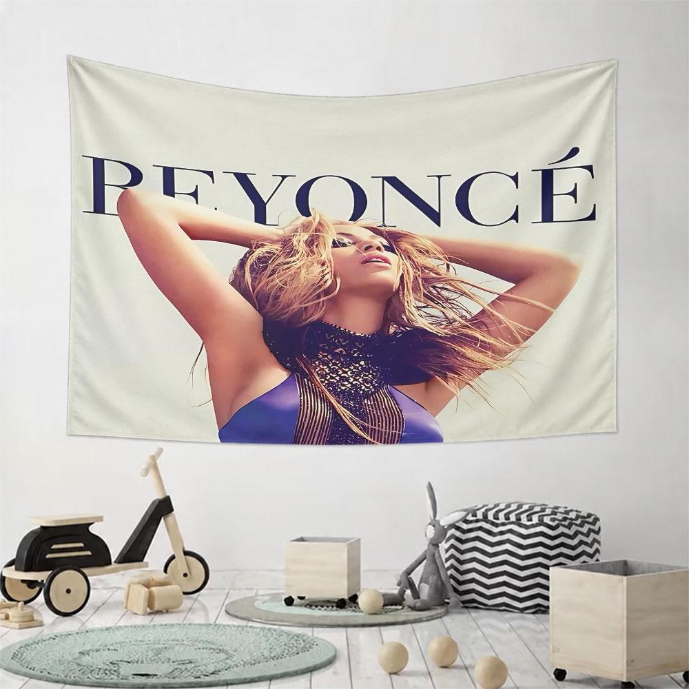 Centered portrait with bold text reading "BEYONCÉ" in uppercase above. Patterned tapestry for bedroom and living room home decor