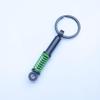 In-Stock Black Shock Absorber Keychain: Pressable Metal Spring Accessory - Perfect Small Gift