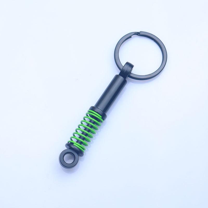 In-Stock Black Shock Absorber Keychain: Pressable Metal Spring Accessory - Perfect Small Gift