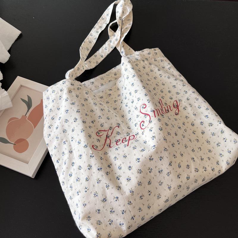 

Korean version ins French retro floral bag niche moonlight blue letter shoulder bag thin fresh cotton women s bag