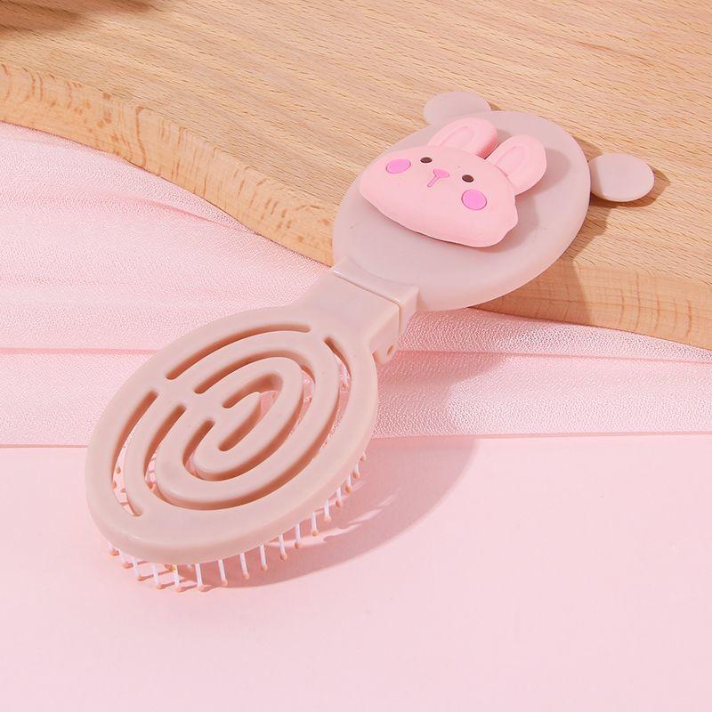 

Складная массажная расческа с героями мультфильмов, небольшая портативная зеркальная расческа, встроенная пластиковая расческа для массажа головы Fold mirror / comb розовый