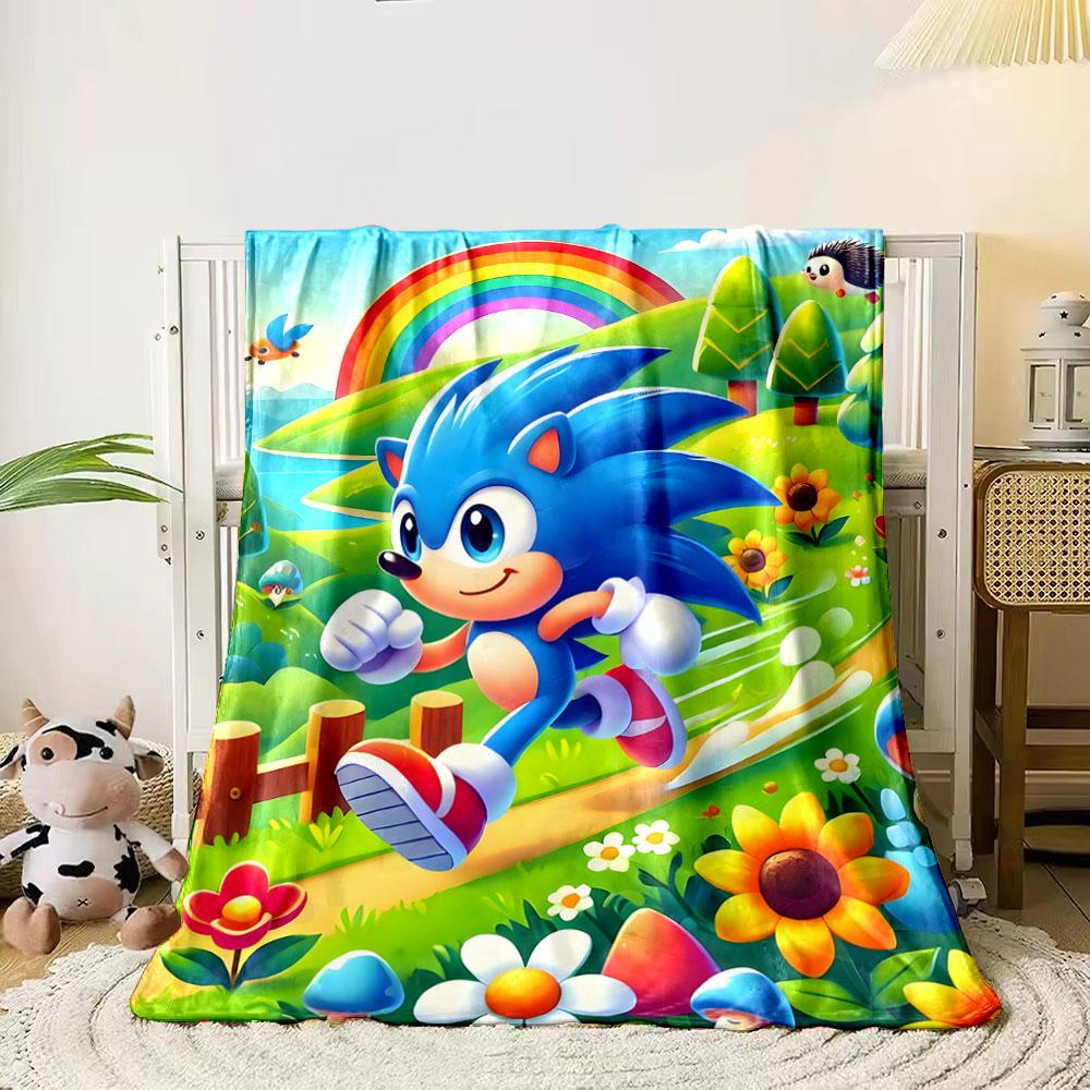 A cartoonish blue hedgehog runs on a path in a vibrant, colorful meadow. for all seasons blanket lunch break throw gift 80cm x 120cm