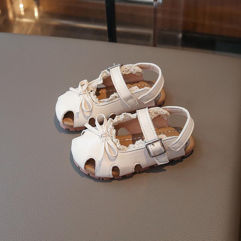 Children's Sandals2026New summer Korean-style versatile bow-knot princess shoes for girls, featuring a soft sole and designed for casual beach wear