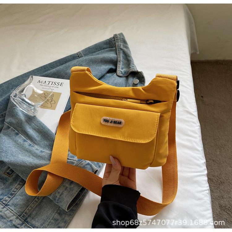 

Women s bag 2025 new casual canvas bag large capacity hand carry simple wind go out shoulder tote bag messenger bag