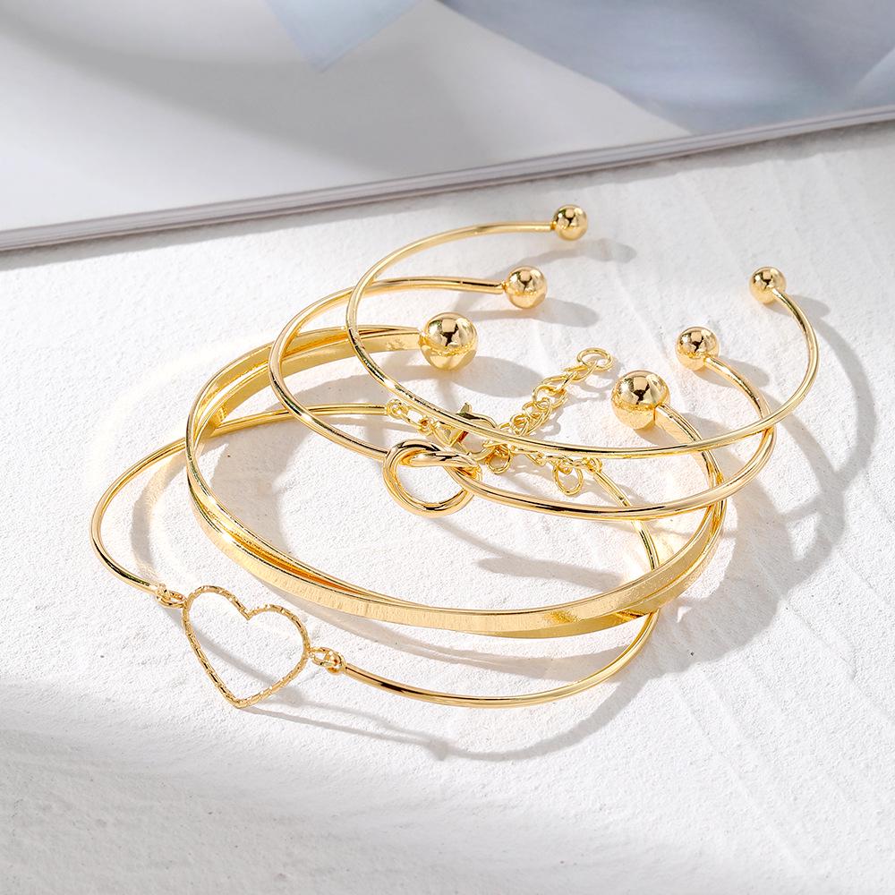 European & American Love Knot Alloy Bracelet Set: 4-Piece Creative Geometric Heart Design